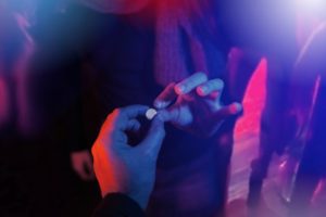 teenager buying drug at club during spring break party